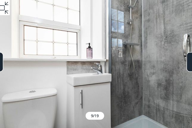 A Modern And Clean Bathroom Featuring A Spacious S...