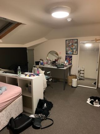 A Spacious Double Bedroom Featuring A Cozy Layout,...