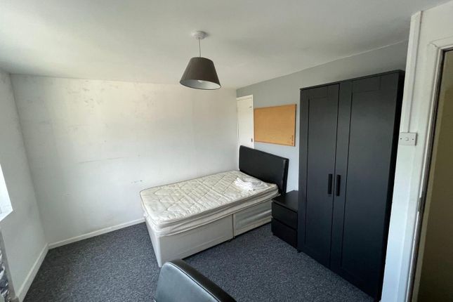 A Cozy Double Bedroom Featuring A Comfortable Bed ...