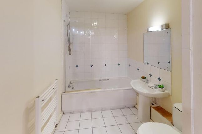 A Bright And Clean Bathroom Featuring A Full-Sized...