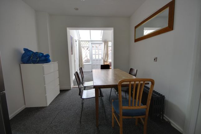 A Bright And Inviting Living Room With Ample Space...