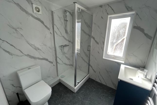 A Modern And Clean Bathroom Featuring A Stylish Sh...