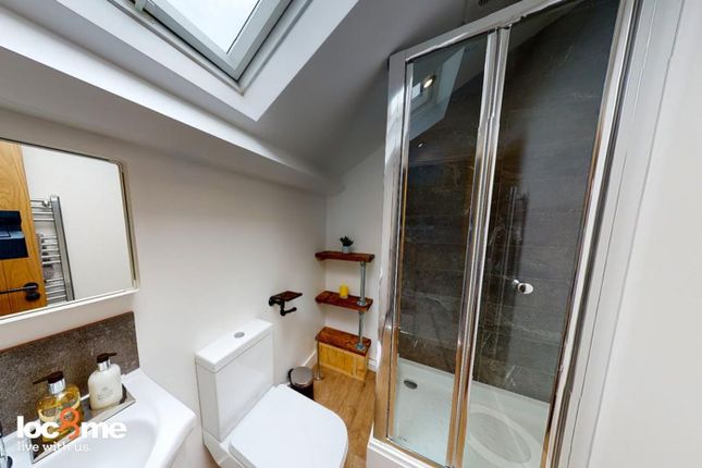 A Modern And Clean Bathroom Featuring A Stylish Sh...