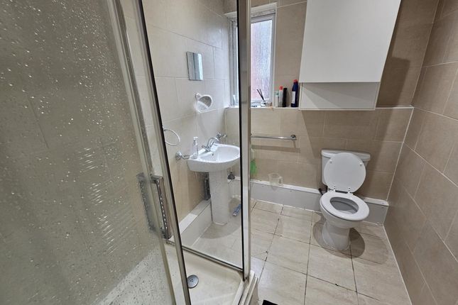 A Clean, Modern Bathroom With A Shower Cabin And A...