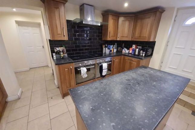 Spacious Kitchen With Ample Wooden Cabinetry, Mode...