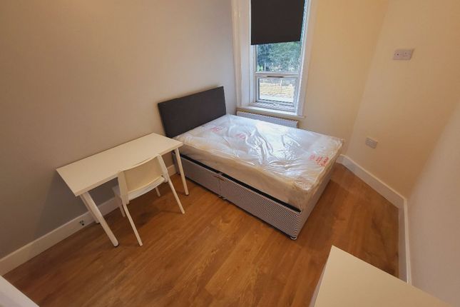 This Cozy Double Bedroom Features Ample Natural li...