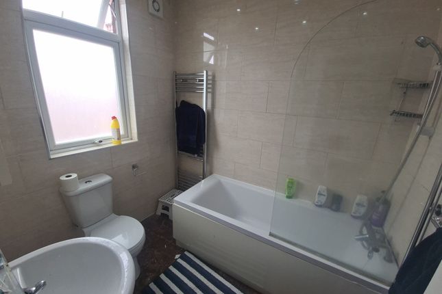 A Modern Bathroom Featuring A Full-Size Bathtub Wi...