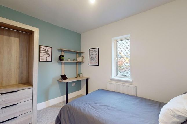 A Bright And Inviting Double Bedroom Featuring A F...
