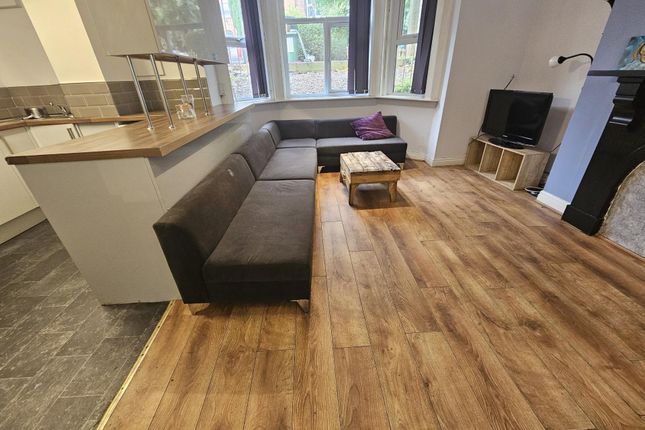 A Spacious, Well-Lit Contemporary Living Room Feat...