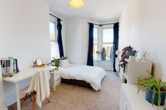 A Bright And Inviting Double Bedroom Featuring Lar...