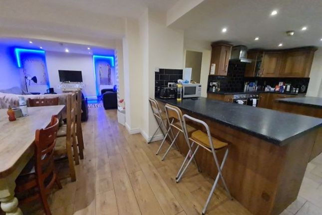 A Modern Kitchen Featuring A Spacious Island With ...