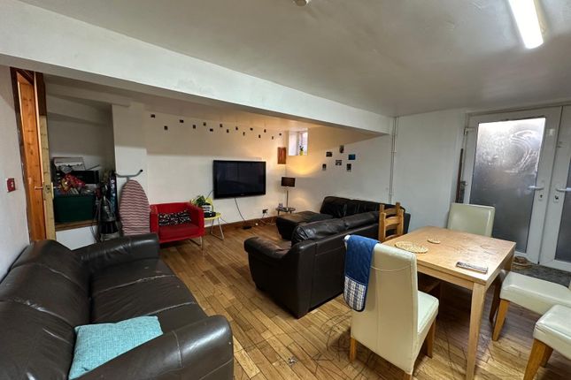 A Spacious, Well-Lit And Inviting Living Room Feat...