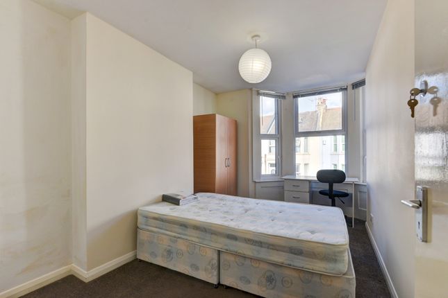 A Well-Lit Double Bedroom Featuring A Standard Bed...