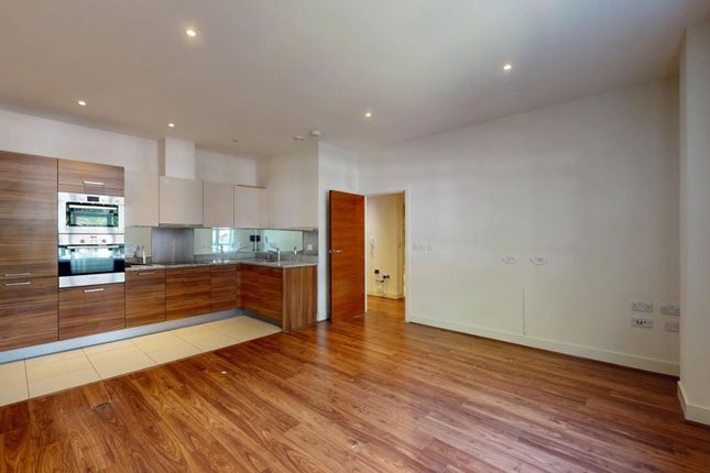 A Modern Open-Plan Living Room With Warm Wood Floo...