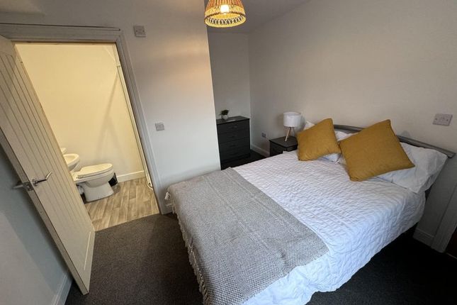 Bright And Cozy Master Bedroom Featuring A Comfort...