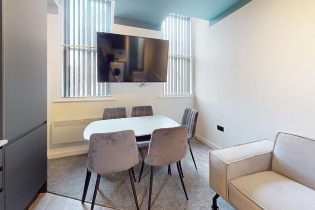 A Bright And Inviting Large Modern Living Room Per...