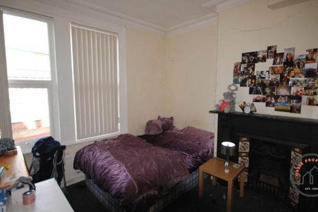 A Spacious, Well-Lit Master Bedroom Featuring A La...