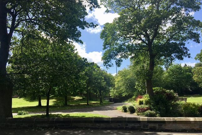 A Beautifully Maintained Garden Area With Lush Gre...