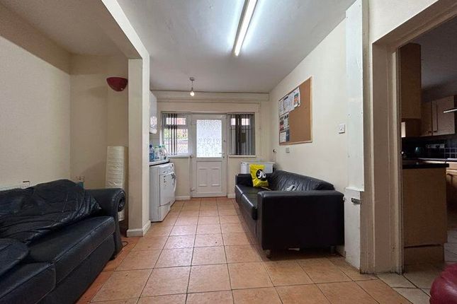 A Bright And Inviting Living Room With Comfortable...