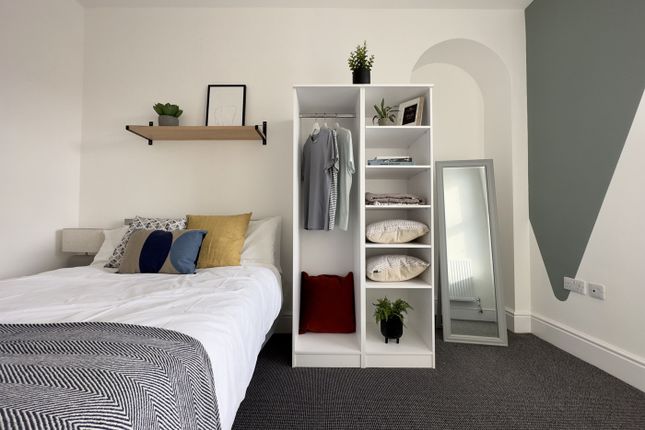 A Bright And Inviting Double Bedroom Featuring Sty...