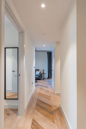 A Well-Maintained And Bright Hallway Leading To In...