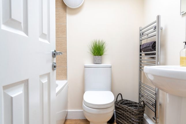 This Well-Maintained Bathroom Features Modern Fitt...