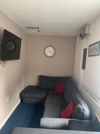 Cozy Living Room Featuring A Comfortable Grey Sect...