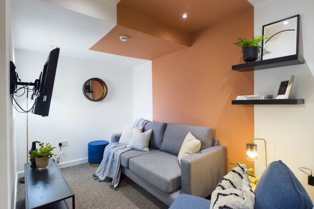 A Stylish And Inviting Large Modern Living Room Pe...