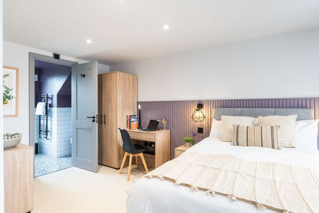 Bright And Modern Master Bedroom Featuring A Comfo...