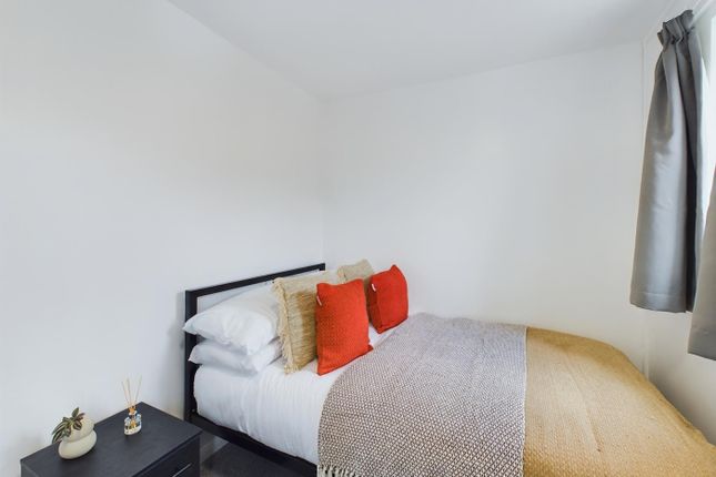 A Cozy And Inviting Double Bedroom With Modern Dec...