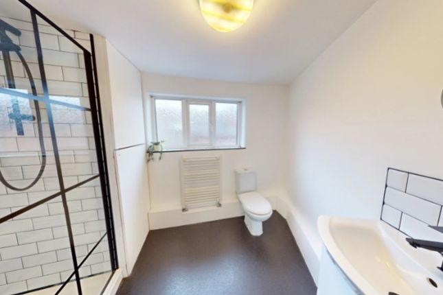 A Bright And Modern Bathroom Featuring A Spacious ...