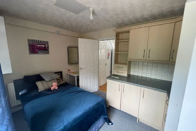 A Cozy Double Bedroom Featuring A Comfortable Bed ...