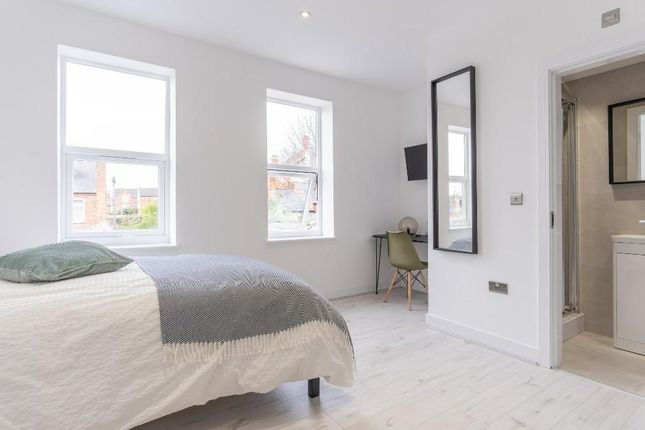 A Bright And Spacious Master Bedroom Featuring Lar...