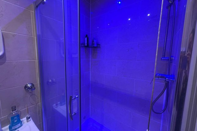 Modern Bathroom With A Spacious Shower Area, Illum...