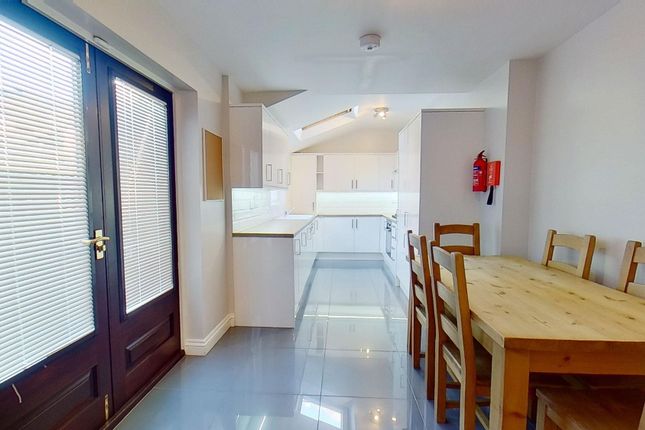 Bright Modern Galley Kitchen And Dining Area With ...