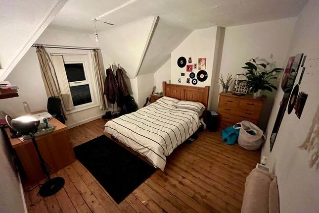 Bright, Neatly Arranged Double Bedroom With Wooden...