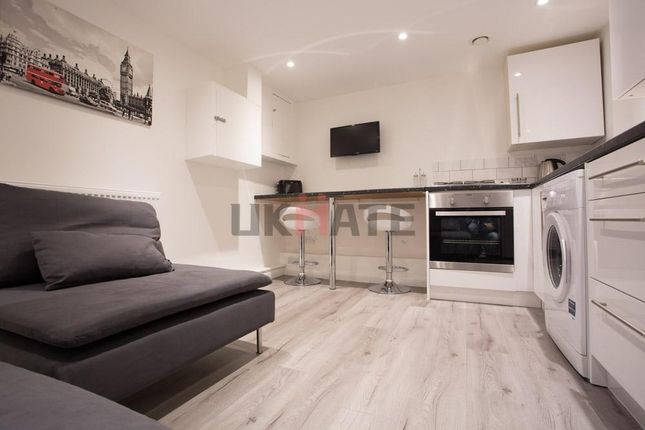 A Modern And Tidy Living Area Featuring A Comforta...