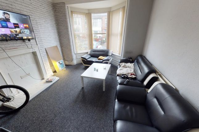 A Modern, Well-Lit Living Room With A Comfortable ...