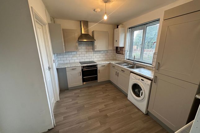 Bright And Modern Kitchen Featuring Ample Cabinetr...
