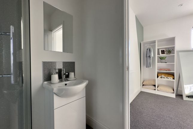 A Modern And Clean Bathroom Featuring Stylish Fixt...