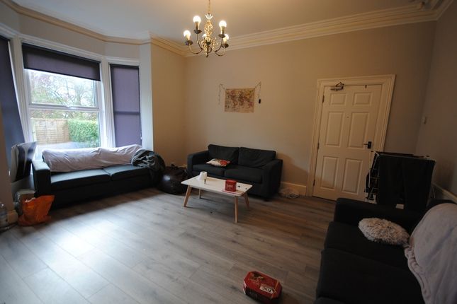 A Spacious And Well-Maintained Living Room Featuri...