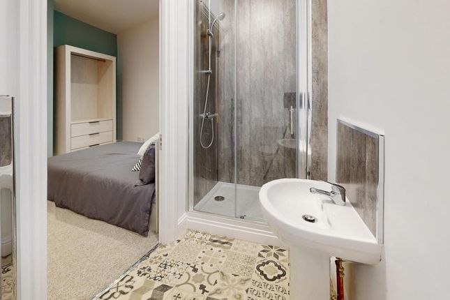 A Spacious And Elegantly Designed Bathroom Featuri...