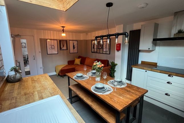 A Modern And Inviting Living Room With A Comfortab...