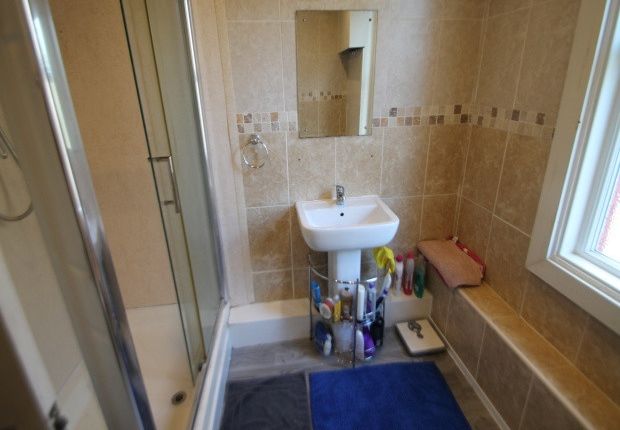 A Clean And Bright Bathroom Featuring A Shower, Sm...