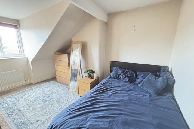 A Cozy Bedroom Featuring A Neatly Made Double Bed ...