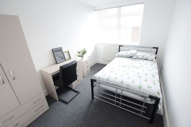 A Bright And Tidy Double Bedroom Featuring A Comfo...