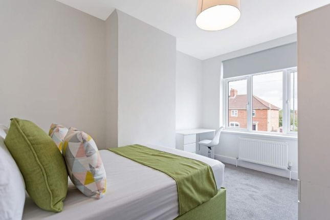 A Bright And Inviting Double Bedroom Featuring Mod...