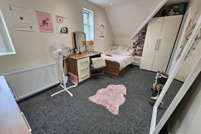 A Cozy Bedroom Featuring A Double Bed, Wardrobe, A...