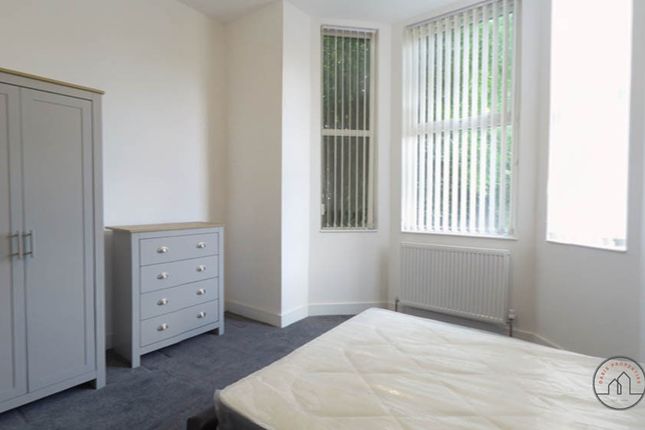 Bright And Welcoming Bedroom With Large Windows Pr...