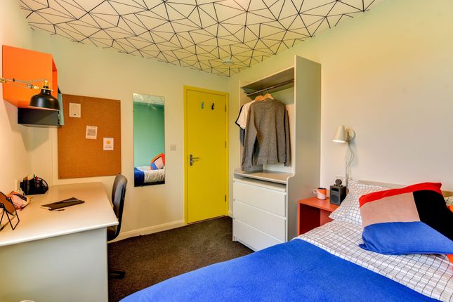 This Inviting Double Bedroom Features A Cozy Layou...